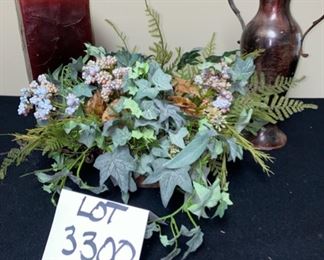 Lot 3300.  $25.00 Cute decor. Rectangular, red candle tower "cracked marble" :  India- 2 handle 10" urn, metal, neat color; floral greenery from O'Briens florist.		