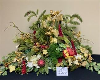 Lot 3303.  $175.00  Gorgeous Christmas Floral Arrangement, custom - made.  Top of the line florals and ornaments. This piece would work well on a mantle or down the middle of a table. 42"W x 22"H   Just beautiful!