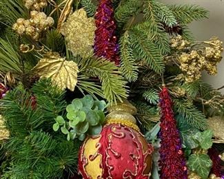 Lot 3303.  $175.00  Gorgeous Christmas Floral Arrangement, custom - made.  Top of the line florals and ornaments. This piece would work well on a mantle or down the middle of a table. 42"W x 22"H   Just beautiful!