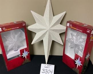 Lot 3304.  $52.00 for all  2 - 11" Color changing, LED Star tree toppers New in Box, (originally $35-$40 ea) and 1- glitter, white hanging star 