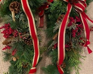 Lot 3306. $75.00 for  2 - Holiday Swags, 30" tall with red ribbons and pinecones. 		