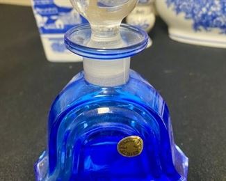 Lot 3318.  $48.00  A Blue & White Bonanza!!!  Includes 6 groupings:  13' x 8.5" x 3.5", Formalities Urn;  Perfume bottle with stopper cobalt blue, bell shape "Collegian Galss Line" Italy; Salt Shaker from Japan; Ginger Jar 8" tall; Candle 3" "Bombay"; Clear Glass & Blue Swirl vase 8" tall; Small bluie pitcher 4" x 5.75"		