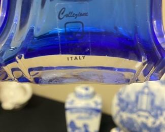 Lot 3318.  $48.00  A Blue & White Bonanza!!!  Includes 6 groupings:  13' x 8.5" x 3.5", Formalities Urn;  Perfume bottle with stopper cobalt blue, bell shape "Collegian Galss Line" Italy; Salt Shaker from Japan; Ginger Jar 8" tall; Candle 3" "Bombay"; Clear Glass & Blue Swirl vase 8" tall; Small bluie pitcher 4" x 5.75"		