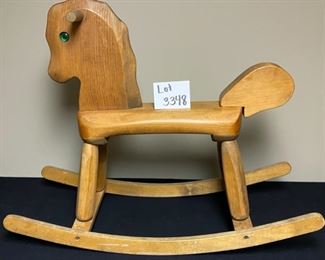 Lot 3348  $38.00  Vintage Child's Rocking Horse medium brown with green eyes	28"H x 6"w x 18"L  x 15"H to seat