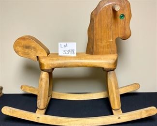 Lot 3348  $38.00  Vintage Child's Rocking Horse medium brown with green eyes	28"H x 6"w x 18"L  x 15"H to seat