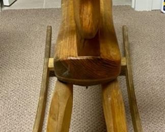 Lot 3348  $38.00  Vintage Child's Rocking Horse medium brown with green eyes	28"H x 6"w x 18"L  x 15"H to seat