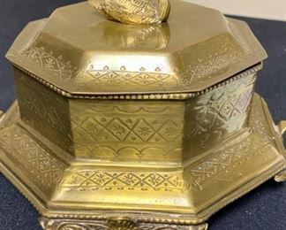 Lot 3350.  $38.00.  Vintage Brass Lot. The star of the show is this brass footed trinket box with swan finial from Andrea by Sadek (7.5 x 7.5 x 5.5"h) also includes a brass candlestick (12"h), brass chamber candle holder (4"), brass pot by Hosley, and a double-handled challis with "W" and 211 on the bottom.		