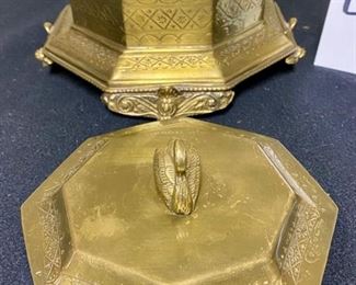 Lot 3350.  $38.00.  Vintage Brass Lot. The star of the show is this brass footed trinket box with swan finial from Andrea by Sadek (7.5 x 7.5 x 5.5"h) also includes a brass candlestick (12"h), brass chamber candle holder (4"), brass pot by Hosley, and a double-handled challis with "W" and 211 on the bottom.		