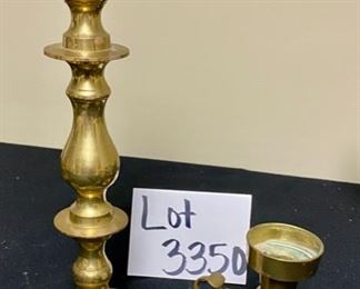 Lot 3350.  $38.00.  Vintage Brass Lot. The star of the show is this brass footed trinket box with swan finial from Andrea by Sadek (7.5 x 7.5 x 5.5"h) also includes a brass candlestick (12"h), brass chamber candle holder (4"), brass pot by Hosley, and a double-handled challis with "W" and 211 on the bottom.		