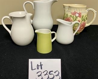 Lot 3353. $45.00. Pitcher Collection: 2 Cordon Bleu 5" and 9" pitchers, 1 Chantal Pitcher 6.5"h, 1 Mikasa 4" high, 1 unbranded ceramic 7.5"		