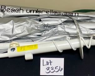 Lot 3356. $35.00.  Solar Reflecting Beach Umbrella with pole and secure Earthworm Sand Grabber Base		