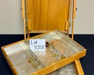 Lot 3358.  $75.00.  Vintage Grumbacher #286 French Easel Field Box. Made in France. The homeowner is an amazing artist, may this inspire your creativity! 19.5 x 12". Here's some info on restoring this lovely piece! http://levineartstudio.com/vintage-grumbacher-286-french-easel/ 	