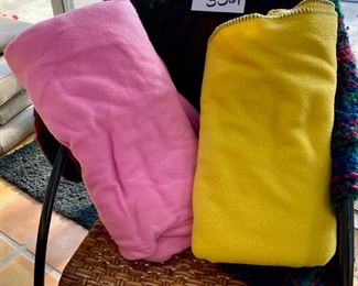 Lot 3361. $30.00.  Throw Blanket/Snuggie Lot Yellow fleece, 48" x 60", a pink snuggie, and a Kennebunk Weavers throw is lovely jewel tones. 