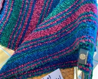 Lot 3361. $30.00.  Throw Blanket/Snuggie Lot Yellow fleece, 48" x 60", a pink snuggie, and a Kennebunk Weavers throw is lovely jewel tones. 