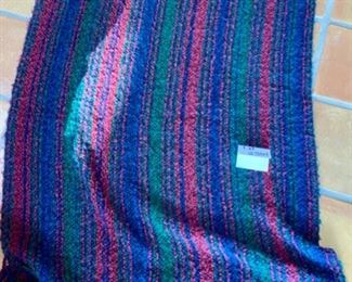 Lot 3361. $30.00.  Throw Blanket/Snuggie Lot Yellow fleece, 48" x 60", a pink snuggie, and a Kennebunk Weavers throw is lovely jewel tones. 