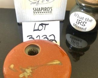 Lot 3232.  $24.00 Two cute pieces make up this lot. 1)Georgetown Pottery vase Ikebana-style, with a nifty flower frog.  and a sweet figurine holding out his pocket "What the IRS missed",  a cork-topped money jar.  