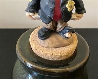 Lot 3232.  $24.00 Two cute pieces make up this lot. 1)Georgetown Pottery vase Ikebana-style, with a nifty flower frog.  (love the color for Fall!) and a sweet figurine holding out his pocket "What the IRS missed",  a cork-topped money jar.  