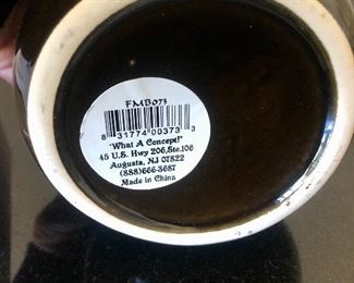 Lot 3232.  $24.00 Two cute pieces make up this lot. 1)Georgetown Pottery vase Ikebana-style, with a nifty flower frog.  (love the color for Fall!) and a sweet figurine holding out his pocket "What the IRS missed",  a cork-topped money jar.  