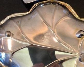 Lot 3233. $44.00 Great Servers for your holiday celebrations.1) Silver-plate leaf dish, 2) International Silver Co. #443 dish, 3) Covered gravy boat with hinged lid, 4) Covered butter dish, 5) Sheffield England spoon and 6) International deep Silver spoon.