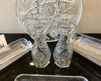 Lot 3234. $36.00  Pressed Glass Platter (11" diameter), Vinegar and Oil cruets with stoppers (7" H) and 6 corn dishes from Brazil (8.5" L).