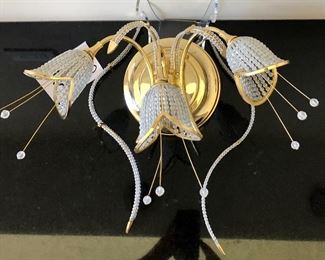Lot 3238.  $180.00  1  Beautiful Beaded tulip sconce with three flowers. Gold tones, Progress Lighting.	16"W x 10" H x 10" diameter base plate.  Very Unique, could work in Hollywood Regency or Art Deco.  