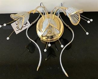 Lot 3238.  $180.00  1  Beautiful Beaded tulip sconce with three flowers. Gold tones, Progress Lighting.	16"W x 10" H x 10" diameter base plate.  Very Unique, could work in Hollywood Regency or Art Deco.  