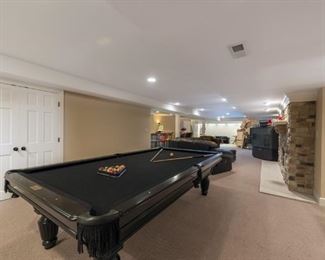 Lot 3271A. $975.00  AMF Play Master 8' regulation, slate top pool table.  This is a sleek black wood frame table with leather pockets and dramatic black felt top.  This lot includes 6 cues, 1 bridge, 1 set of billiard balls and table accessories. In great condition.  Ask us about the Pool Table Service, we use to deliver and assemble this pool table. This item will need to be professionally moved! 