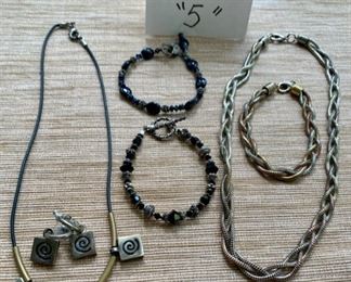 Jewelry & Misc. Lot 5 - $40.00. 6 pieces of attractive costume jewelry, including 2 black beaded bracelets for a slender wrist, 1 Modern Art Necklace, 1 pair of matching earrings, and 1 Serpentine "braided" necklace and a matching bracelet in gold, silver, and copper tone metals.  Nice lot.