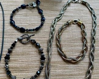 Jewelry & Misc. Lot 5 - $40.00. 6 pieces of attractive costume jewelry, including 2 black beaded bracelets for a slender wrist, 1 Modern Art Necklace, 1 pair of matching earrings, and 1 Serpentine "braided" necklace and a matching bracelet in gold, silver, and copper tone metals.  Nice lot.