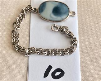 $22.00.    Sterling silver link bracelet with oval blue porcelain disk backed with silver.  Bracelet is 5.5" long.