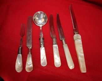 50% Off. Now $10.                                                                           $20. Assortment of mother of pearl handed flatware.
