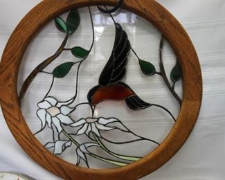 50% Off. Now $25.                                                                               $50. Hummingbird, stained glass hanging. 21 inch diameter.