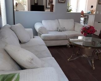  Sofa's and glass/metal coffee table