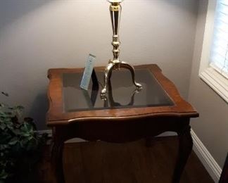 side table and brass lamp