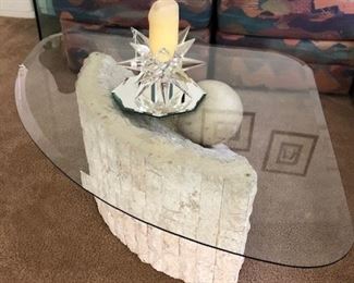 Glass designer coffee table with rock like base