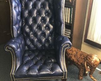 Blue leather wing-back chair "chesterfield-styling" with nailhead detail $600