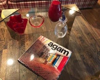 Brass and Glass coffee table (36" square x 16" H) with 3/4" glass $400, colored glassware $15 - $75, and art books $20 - 25