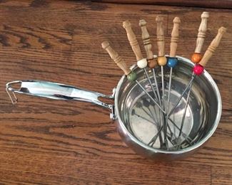 Measuring cup and fondue forks.