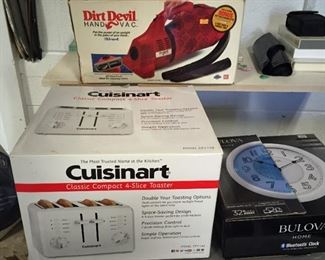 Cusinart four-slice toaster and Dirt Devil Hand Vac.