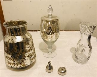 Far left etched glass lantern full of wine corks 11" high $20. Decorative glass jar with finial lid 14.5" tall $19. Cut glass vase 10" tall $15.