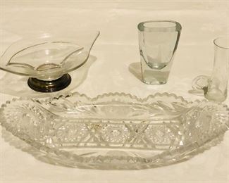 Relish dish $9. Candy dish with metal bottom $8. Crystal sailboat shot glass $25. Vintage crystal shot glass with handle $18. 
