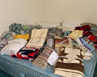 King size mattress and box springs and lots of linens