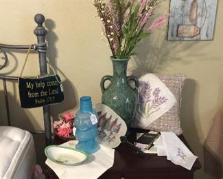 We have two of these bedside tables with lots of storage, lots and lots of vintage hankies, floral, interesting water container.