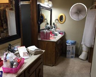 The Master Bathroom.  Lots of hair styling tools, Tights and knee high socks, humidifiers, nail items