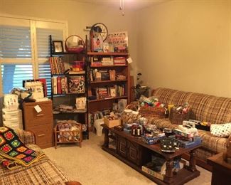 This bedroom contains, books, games, vintage furniture, sewing items and office supplies