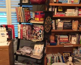 Black shelf and an oak book shelf, sewing books and magazines also cooking