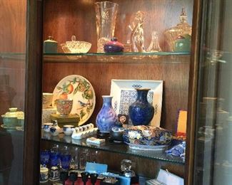 #22 Showing the lights on in the china cabinet and the wonderful finds inside