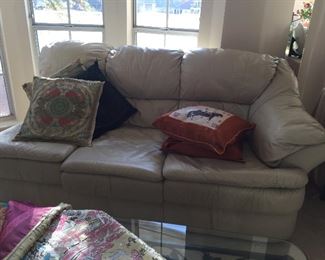 #42 A section of the cream leather sectional sofa, silk cushions