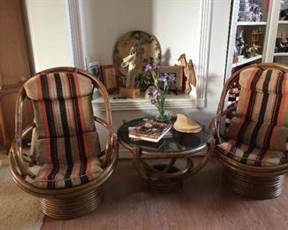 #49 Showing both of the rocking/swivel chairs and a round glass top Bamboo table