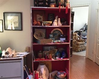 Red shelf, art work, pottery, ginger jars, brass items, statuary, cards and magnets 